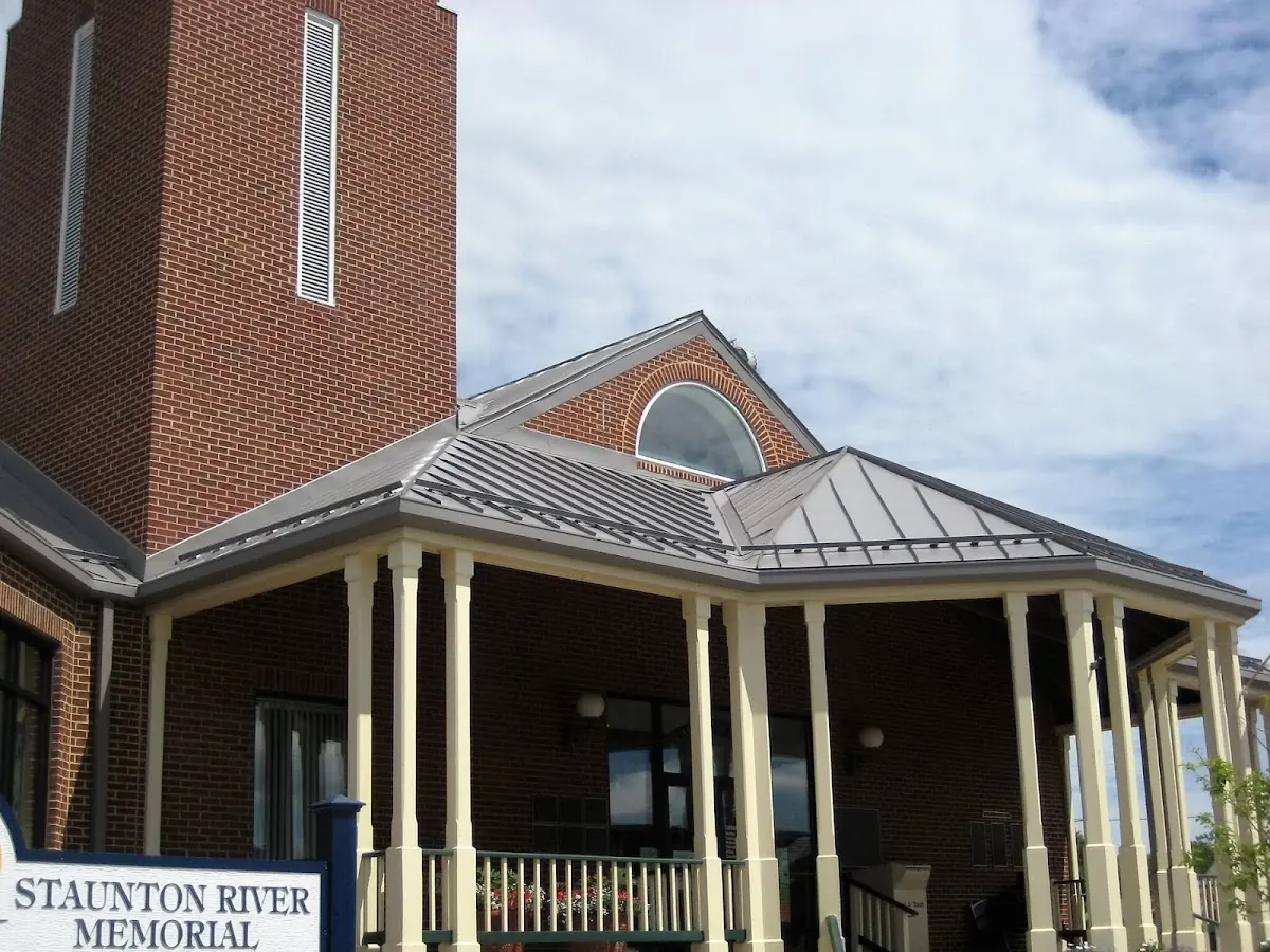 Skilled roofing craftsmen working on a residential roof in Senoia